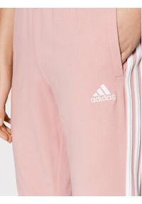 Adidas - adidas Spodnie dresowe Essentials HD4272 Różowy Slim Fit. Kolor: różowy. Materiał: bawełna, dresówka #3