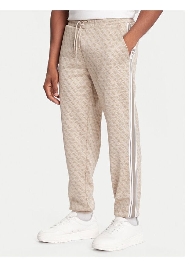 Guess Spodnie dresowe Z5BB19 K2042 Beżowy Regular Fit. Kolor: beżowy. Materiał: syntetyk