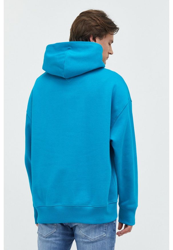 Tommy Jeans bluza bawełniana męska kolor turkusowy z kapturem z aplikacją. Typ kołnierza: kaptur. Kolor: turkusowy. Materiał: bawełna. Wzór: aplikacja