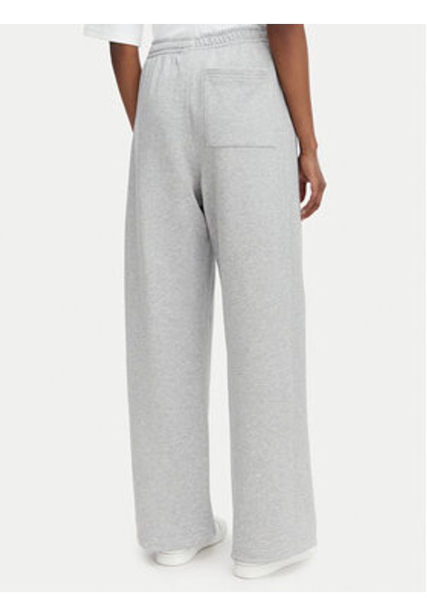 Calvin Klein Jeans Spodnie dresowe LV047C249G Szary jasny Regular Fit. Kolor: szary. Materiał: bawełna