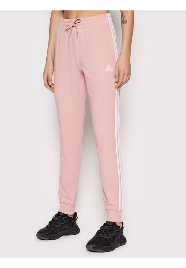 Adidas - adidas Spodnie dresowe Essentials HD4272 Różowy Slim Fit. Kolor: różowy. Materiał: bawełna, dresówka