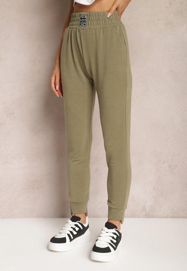 Renee - Zielone Spodnie Dresowe High Waist z Kieszeniami i Ściągaczami Falira. Stan: podwyższony. Kolor: zielony. Materiał: dresówka. Styl: sportowy, elegancki