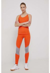 Adidas by Stella McCartney - adidas by Stella McCartney legginsy treningowe damskie kolor pomarańczowy wzorzyste. Kolor: pomarańczowy. Materiał: skóra, poliester, materiał, dzianina. Wzór: ażurowy, ze splotem