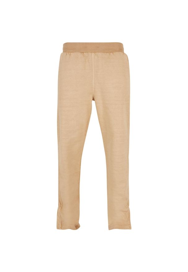 Barwiony na frotte spodnie dresowe z grubym rozcięciem Urban Classics GT. Kolor: beżowy. Materiał: dresówka