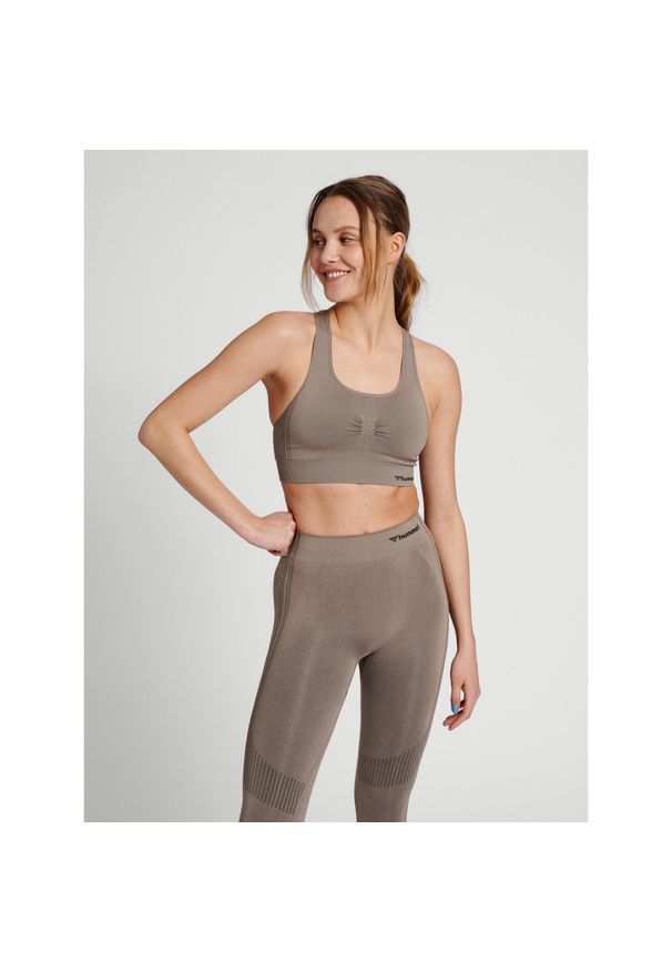 Damski bezszwowy biustonosz sportowy Hummel Shaping. Kolor: szary, brązowy, zielony, wielokolorowy, beżowy. Sport: fitness
