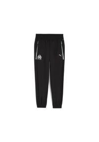 Puma - Spodnie dresowe OM Woven 2025/26. Kolor: czarny. Materiał: dresówka. Sport: piłka nożna #1
