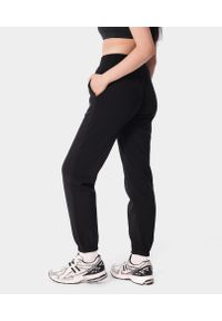 Spodnie dresowe sportowe dla kobiet Carpatree Varsity Chic. Kolor: czarny. Materiał: dresówka. Sport: fitness