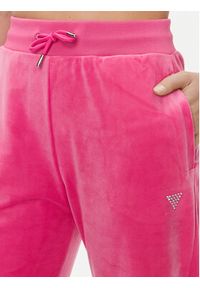 Guess Spodnie dresowe Couture V3BB26 KBXI2 Różowy Regular Fit. Kolor: różowy. Materiał: syntetyk