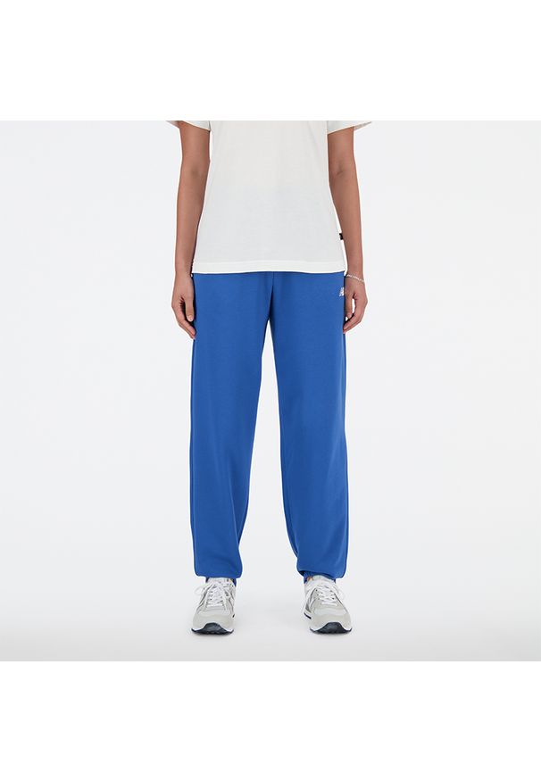 Spodnie damskie New Balance WP41500BEU – niebieskie. Stan: podwyższony. Kolor: niebieski. Materiał: bawełna, dresówka, poliester