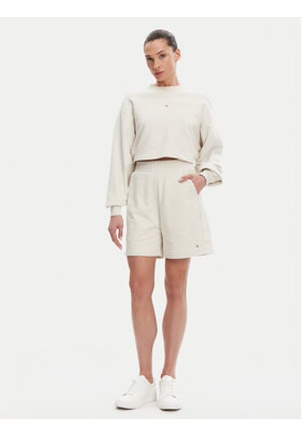 Calvin Klein Jeans Szorty sportowe J20J225221 Beżowy Relaxed Fit. Kolor: beżowy. Materiał: bawełna