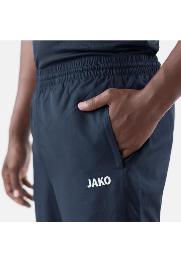 Spodnie dresowe dla dzieci Jako de loisir Classico. Kolor: niebieski. Materiał: dresówka. Sport: piłka nożna