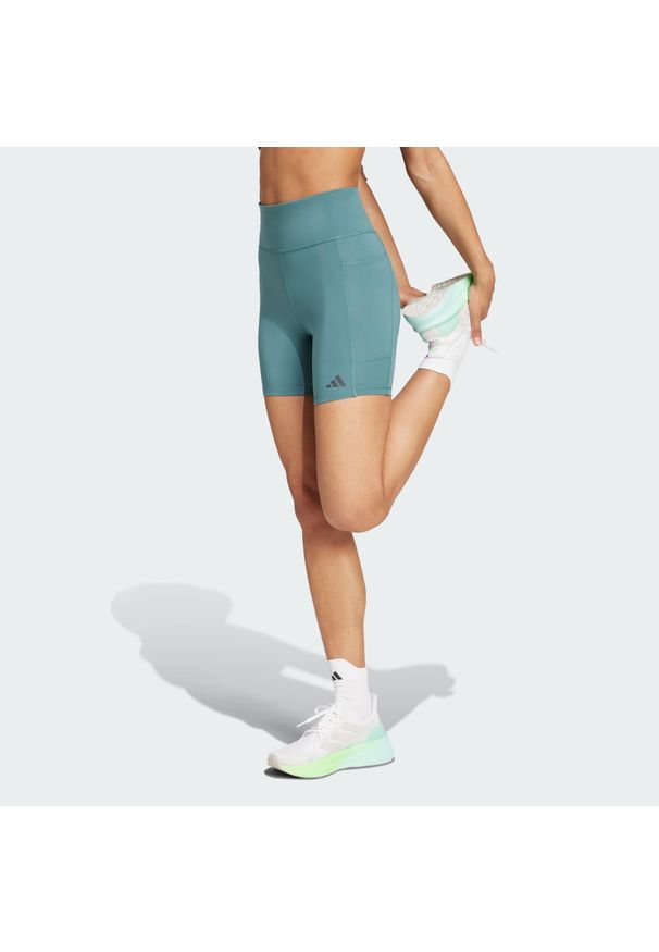 Adidas - Legginsy Own the Run Short. Kolor: niebieski. Materiał: materiał. Długość: krótkie. Sport: bieganie