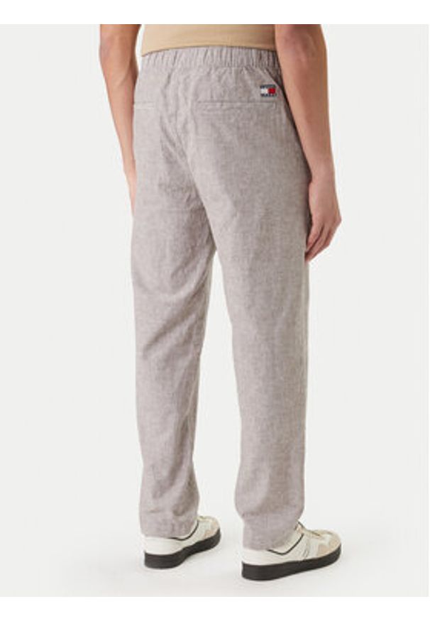 Tommy Jeans Spodnie materiałowe Sonny DM0DM22820 Beżowy Slim Fit. Kolor: beżowy. Materiał: bawełna