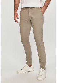 Calvin Klein Jeans - Spodnie. Kolor: szary. Materiał: tkanina, bawełna, elastan. Wzór: gładki #1