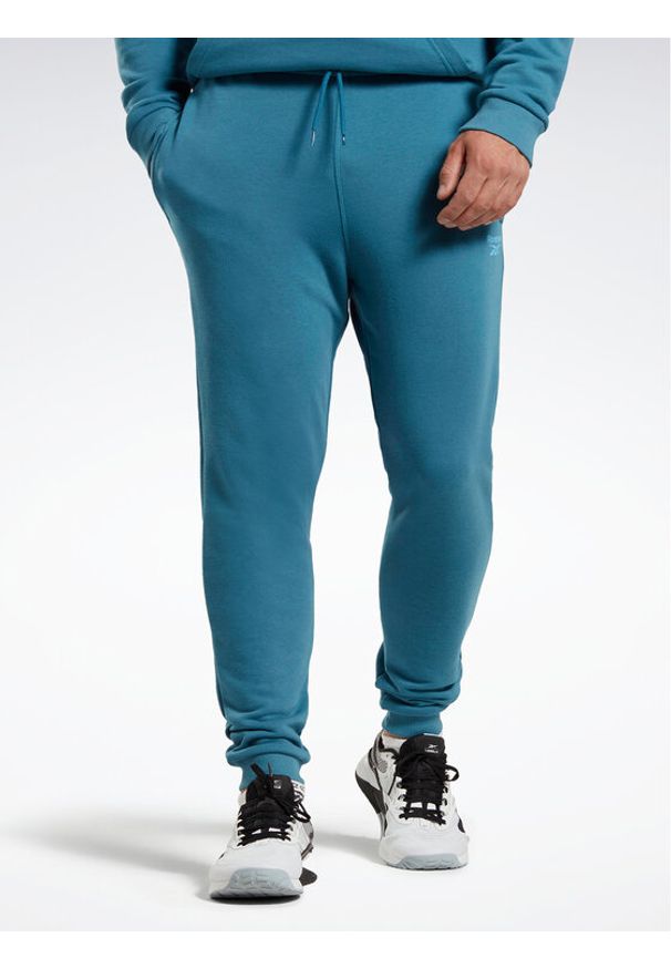 Reebok Spodnie dresowe Reebok Identity French Terry Joggers H49680 Niebieski Regular Fit. Kolor: niebieski. Materiał: bawełna
