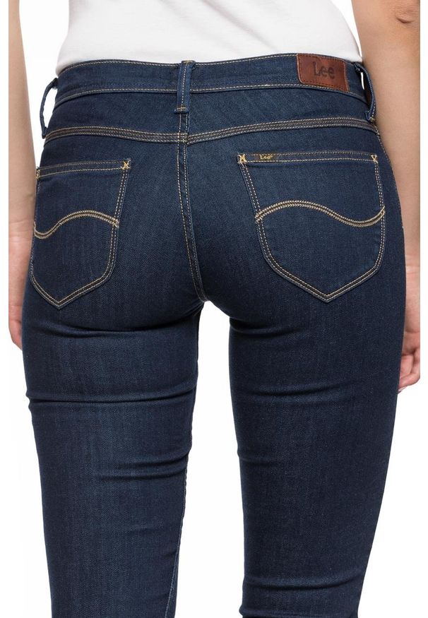 Lee - SPODNIE DAMSKIE LEE JADE SOLID BLUE L331HAKT. Wzór: jednolity