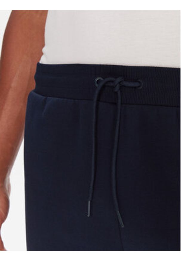 Reebok Spodnie dresowe RK25146CCM Granatowy Regular Fit. Kolor: niebieski. Materiał: syntetyk, bawełna