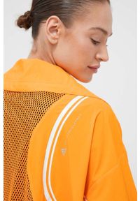 Adidas by Stella McCartney - adidas by Stella McCartney wiatrówka TruePace kolor pomarańczowy przejściowa oversize. Kolor: pomarańczowy. Materiał: materiał #3