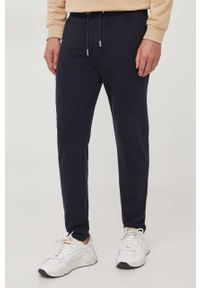 Karl Lagerfeld spodnie dresowe kolor granatowy melanżowe. Kolor: niebieski. Materiał: dresówka. Wzór: melanż