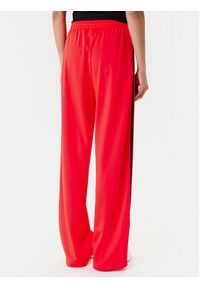 Adidas - adidas Spodnie dresowe adicolor Classic Firebird JW1227 Pomarańczowy Loose Fit. Kolor: pomarańczowy. Materiał: syntetyk #4