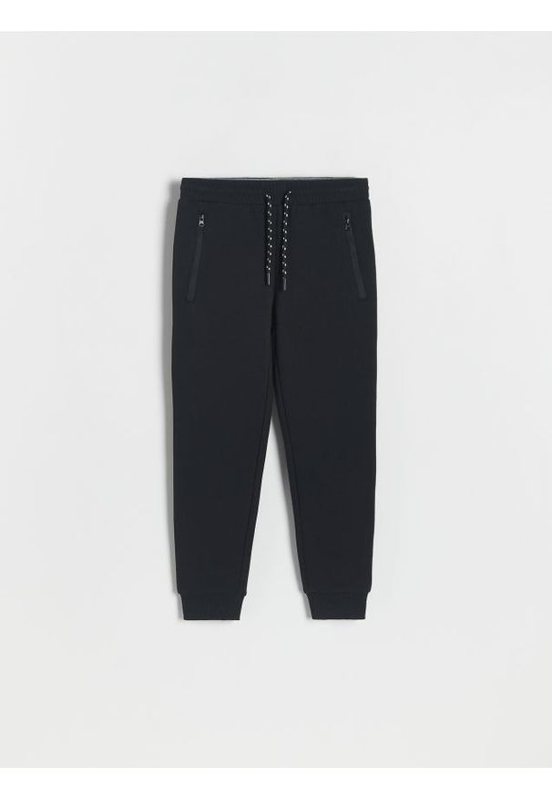 Reserved - Dresowe spodnie jogger - czarny. Kolor: czarny. Materiał: dresówka
