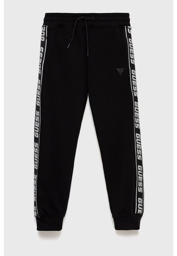 Guess spodnie dresowe dziecięce kolor czarny z aplikacją. Okazja: na co dzień. Kolor: czarny. Materiał: dresówka. Wzór: aplikacja. Styl: casual