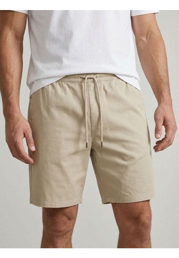 Sinsay - Bawełniane szorty jogger - beżowy. Kolor: beżowy. Materiał: bawełna