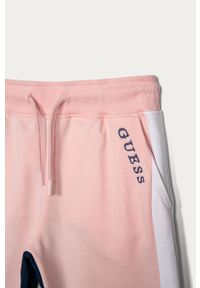Guess - Spodnie dziecięce 116-175 cm. Kolor: różowy. Materiał: bawełna, dzianina. Wzór: nadruk #3