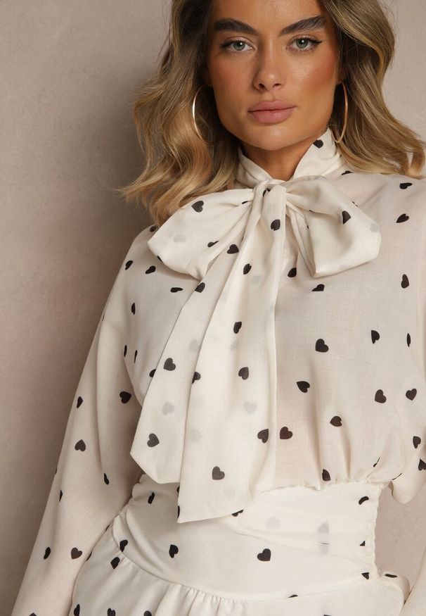 Renee - Beżowa Sukienka o Rozkloszowanym Kroju z Nietoperzowymi Rękawami i Wiązaniem Mironaria. Okazja: na co dzień. Kolor: beżowy. Długość rękawa: długi rękaw. Typ sukienki: rozkloszowane. Styl: casual, elegancki