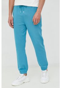 United Colors of Benetton spodnie dresowe bawełniane męskie kolor niebieski z nadrukiem. Kolor: niebieski. Materiał: bawełna, dresówka. Wzór: nadruk #1