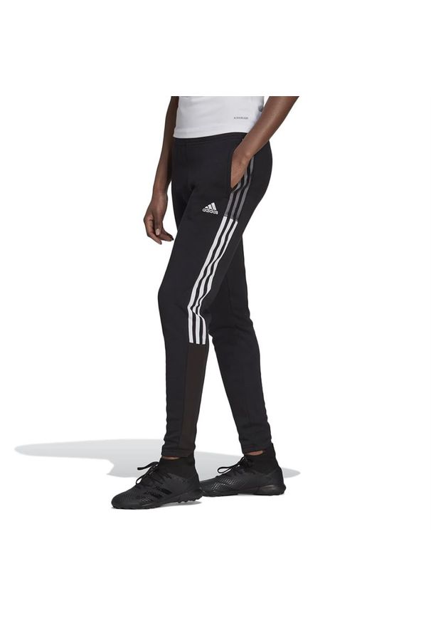 Adidas - Spodnie dresowe adidas Tiro 21 Sweat Pants GM7334 - czarne. Kolor: czarny. Materiał: dresówka. Wzór: paski. Sport: fitness, piłka nożna