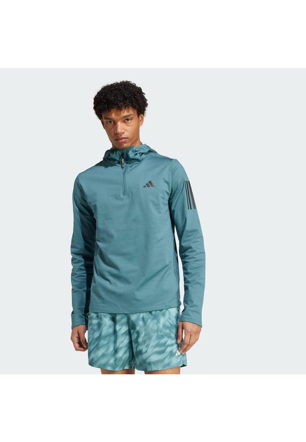 Adidas - Bluza z kapturem Own The Run Winterized Hooded Half-Zip. Typ kołnierza: kaptur. Kolor: niebieski. Technologia: ClimaWarm (Adidas). Sport: bieganie