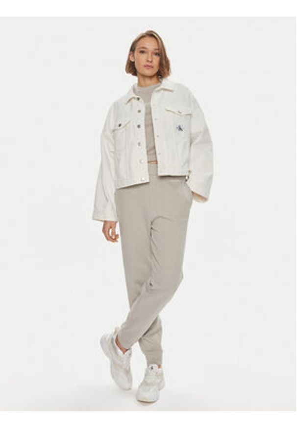 Calvin Klein Spodnie dresowe Micro Logo K20K206632 Beżowy Regular Fit. Kolor: beżowy. Materiał: bawełna