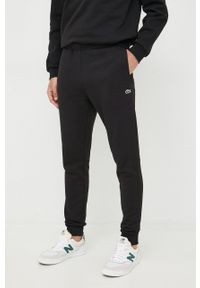 Lacoste spodnie dresowe męskie kolor czarny gładkie XH9624-132. Kolor: czarny. Materiał: dresówka. Wzór: gładki #1