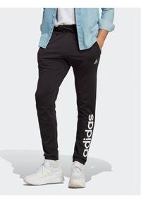 Adidas - adidas Spodnie dresowe Essentials Single Jersey Tapered Elasticized Cuff Logo Joggers IC0055 Czarny Regular Fit. Kolor: czarny. Materiał: bawełna #1
