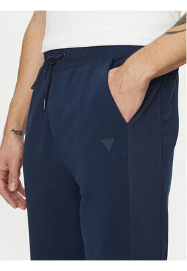 Guess Spodnie dresowe Z5GB06 K6ZS1 Granatowy Regular Fit. Kolor: niebieski. Materiał: bawełna