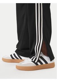 Adidas - adidas Spodnie dresowe Firebird KD8315 Czarny Loose Fit. Kolor: czarny. Materiał: syntetyk #2
