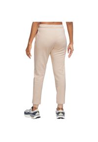 Nike - Spodnie sportowe damskie W NSW Club Fleece Pant. Kolor: beżowy. Materiał: bawełna, poliester