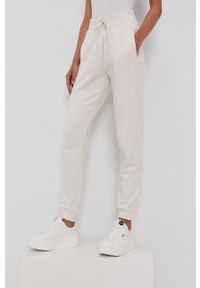 adidas Originals - Spodnie. Kolor: beżowy. Materiał: bawełna. Wzór: gładki #3