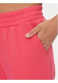 Calvin Klein Jeans Spodnie dresowe J20J220675 Różowy Relaxed Fit. Kolor: różowy. Materiał: syntetyk, bawełna