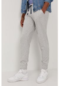 Tommy Jeans Spodnie męskie kolor szary melanżowe. Kolor: szary. Materiał: bawełna. Wzór: melanż #1