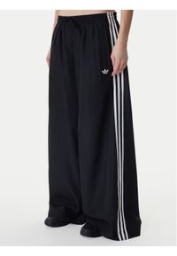 Adidas - adidas Spodnie dresowe Firebird Adilenium KD2914 Czarny Regular Fit. Kolor: czarny. Materiał: syntetyk #1