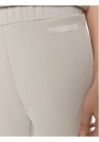 Calvin Klein Spodnie dresowe Micro Logo K20K206632 Beżowy Regular Fit. Kolor: beżowy. Materiał: bawełna