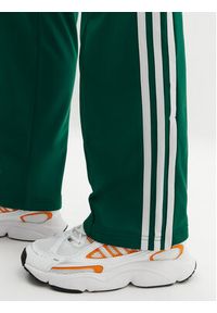 Adidas - adidas Spodnie dresowe adicolor Classics Firebird JC8284 Zielony Regular Fit. Kolor: zielony. Materiał: syntetyk