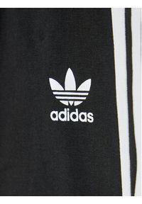 Adidas - adidas Legginsy adicolor Tights H25256 Czarny Slim Fit. Kolor: czarny. Materiał: bawełna