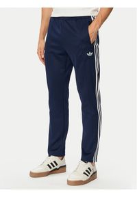 Adidas - adidas Spodnie dresowe Beckenbauer Track KE3529 Granatowy Regular Fit. Kolor: niebieski. Materiał: dresówka #1