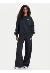 New Balance Spodnie dresowe WP53902 Czarny Relaxed Fit. Kolor: czarny. Materiał: bawełna