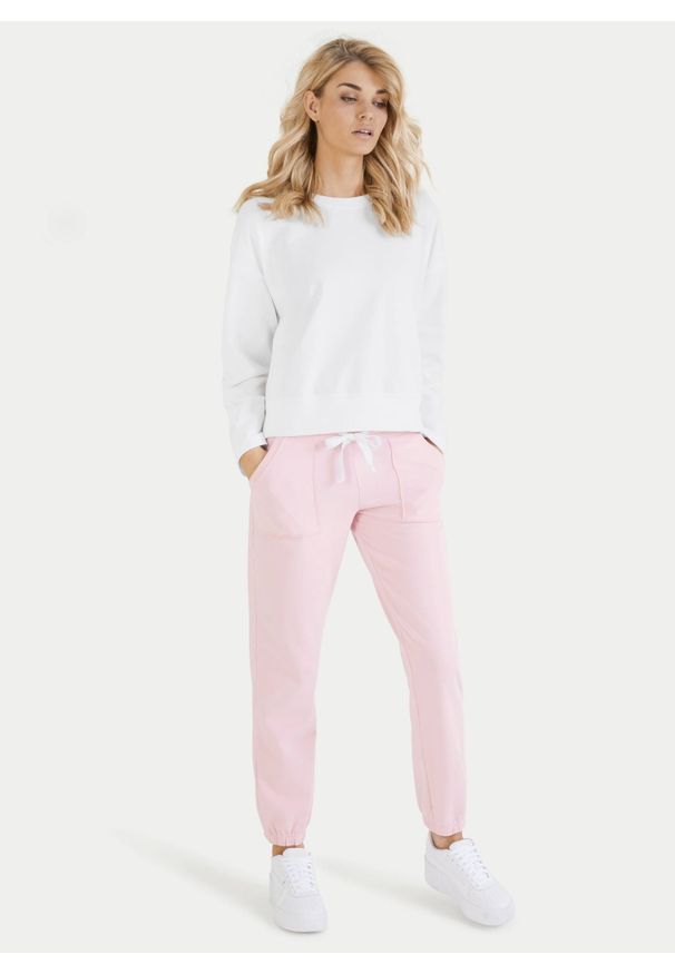 Różowe bawełniane spodnie dresowe ze ściągaczami Juvia. Kolor: różowy. Materiał: dresówka, bawełna