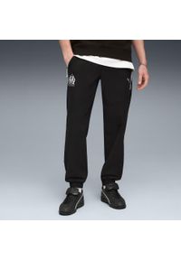 Puma - Spodnie dresowe OM Woven 2025/26. Kolor: czarny. Materiał: dresówka. Sport: piłka nożna #2