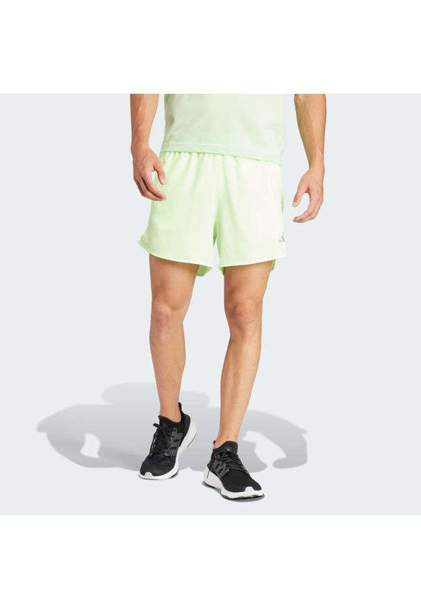 Adidas - Szorty Run It. Kolor: zielony. Materiał: materiał. Sport: bieganie